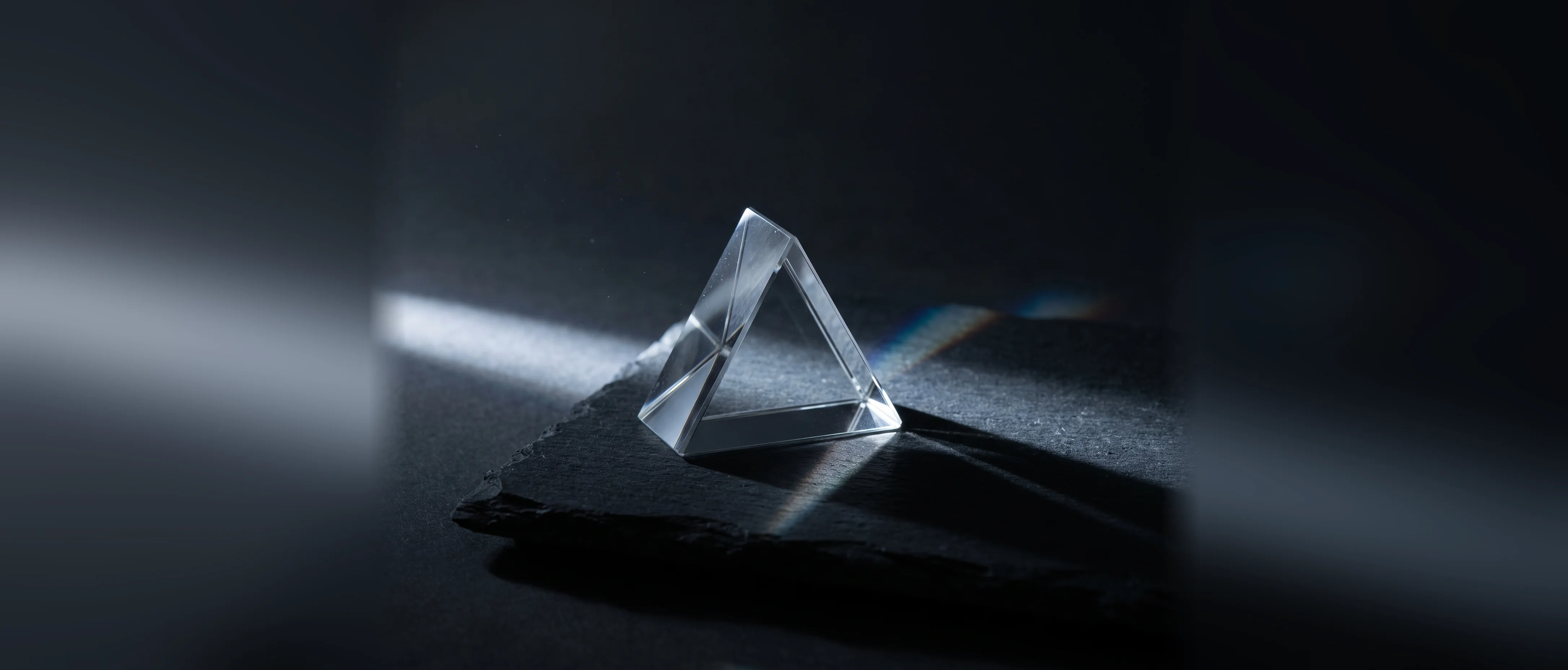 A glass prism separating a single beam of light